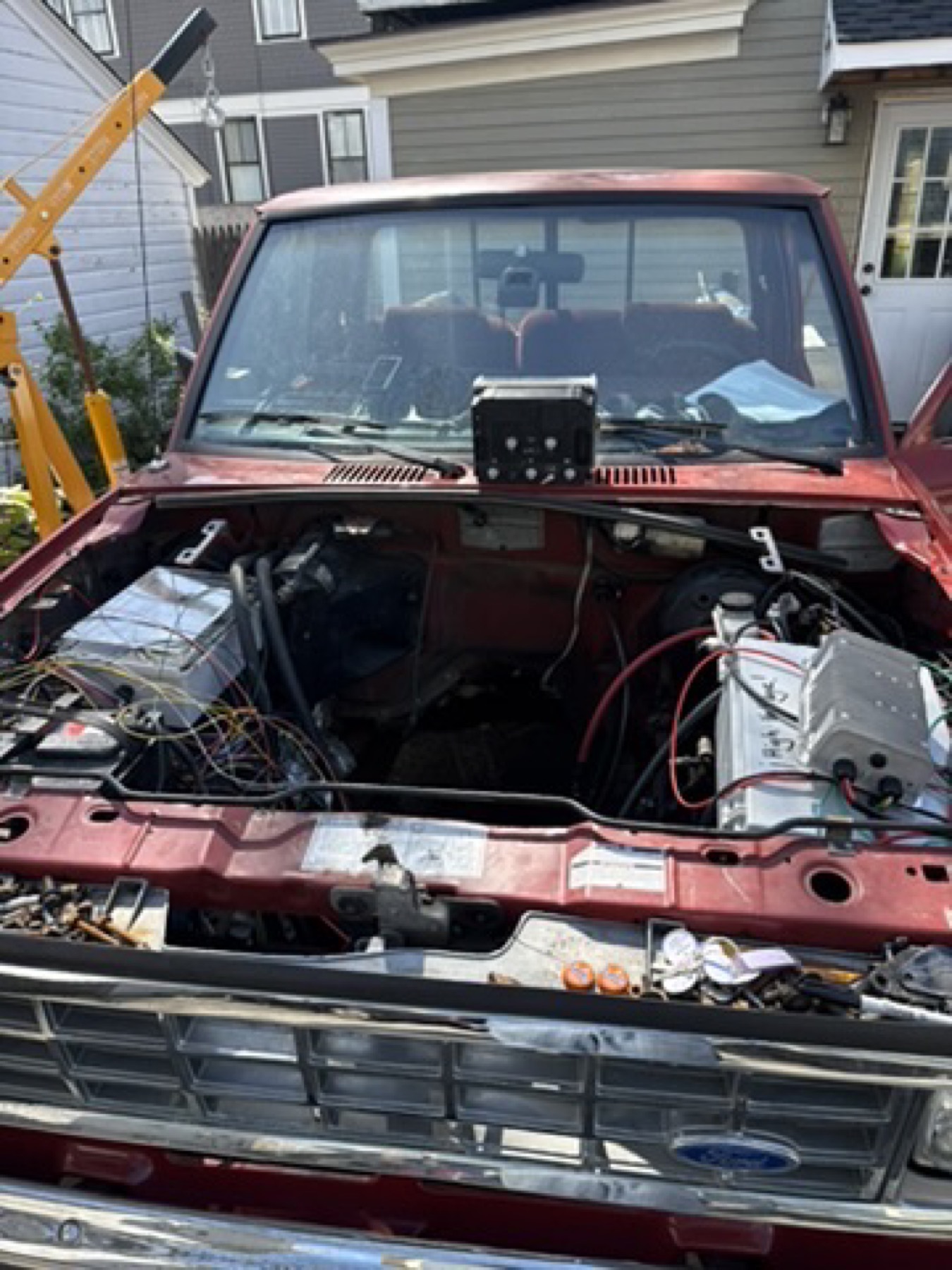 Engine bay with high voltage components mounted