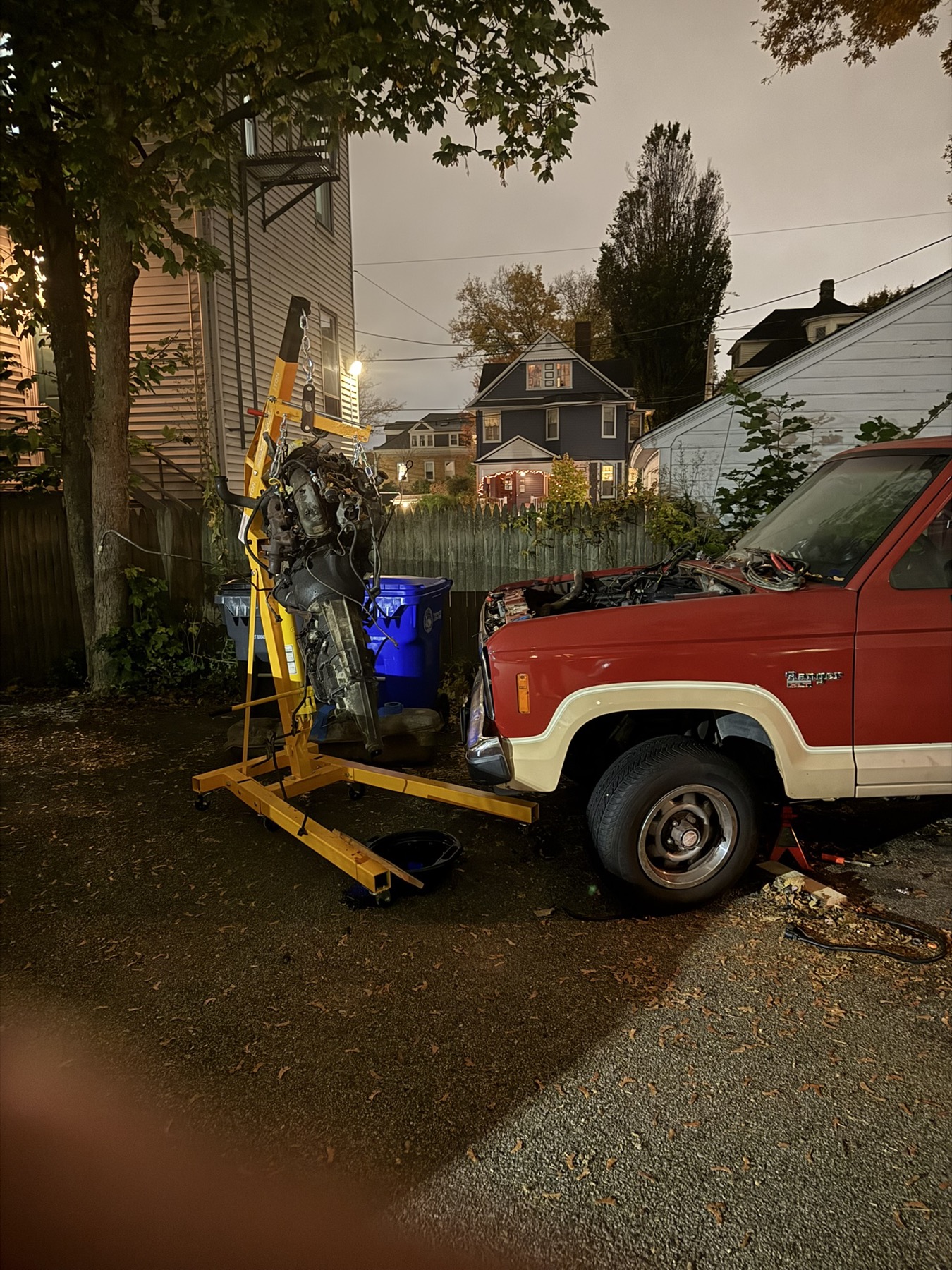 The gas engine pulled out of the Ranger on an engine hoist